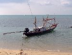 Long boat by the beach