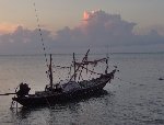 Sunset and long tail boat